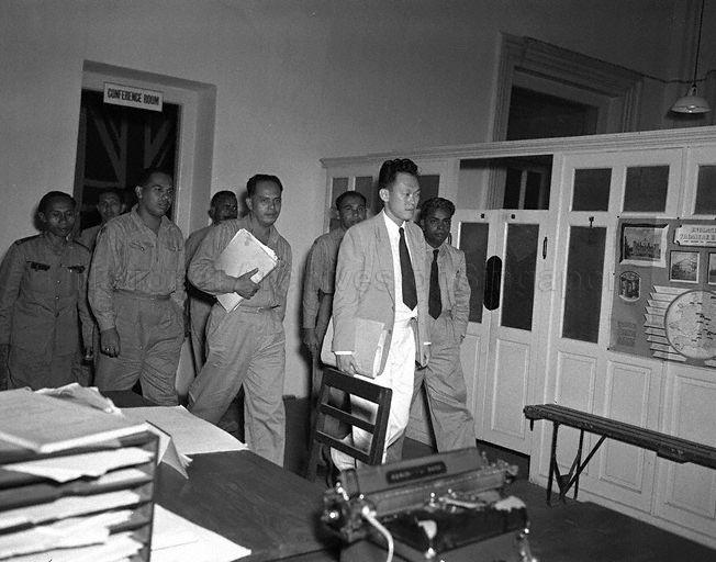 Lee Kuan Yew leaving the conference room at the Colonial Secretary's Office with Union's executive committee members Credit: Singapore Press Holdings