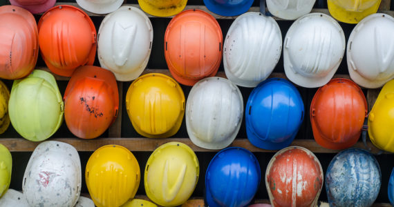 rows of construction helmets in various colours (Workplace Safety, Injuries, & The Law_Asia_Law_Network)