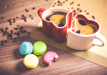 a red and white heart shape cup with coffee and macaroons on the side (Separation in divorce)