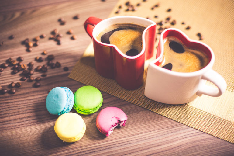 a red and white heart shape cup with coffee and macaroons on the side (Separation in divorce)