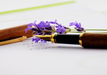 fountain pen on a paper with purple flowers (lasting_power_of_attorney_fblive)