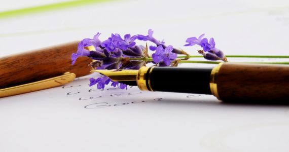 fountain pen on a paper with purple flowers (lasting_power_of_attorney_fblive)