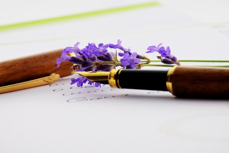 fountain pen on a paper with purple flowers (lasting_power_of_attorney_fblive)
