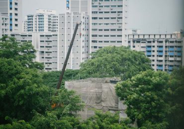construction site in Singapore against a backdrop of public housing (4 Common Types of Accident Claims in Singapore_Asia_Law_Network)