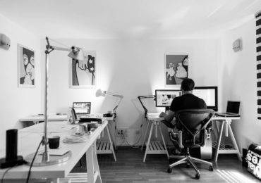 black and white photo of man working on a desptop computer (computer_generated_graphic_copyright_Asia_Law_Network)