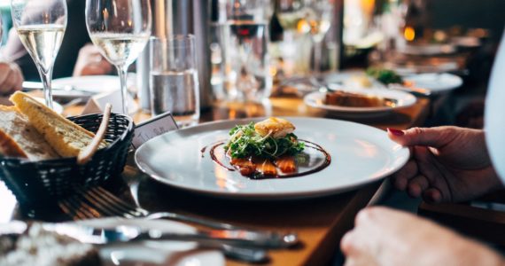 plate of food on table with wine (starting F&B business_Asia_Law_Network)