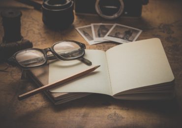 nostalgic photo with a paper, pencil and glasses on a table (Becoming the Executora nostl of a Will_Asia_Law_Network)