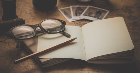 nostalgic photo with a paper, pencil and glasses on a table (Becoming the Executora nostl of a Will_Asia_Law_Network)