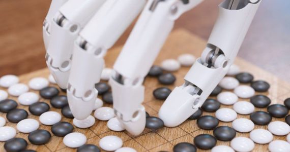 robotic hand playing Othello (The legal advice that AI and fintech startups need_Asia_Law_Network_Tech_in_Asia)