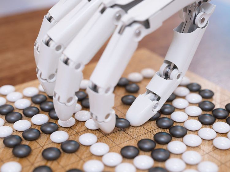robotic hand playing Othello (The legal advice that AI and fintech startups need_Asia_Law_Network_Tech_in_Asia)